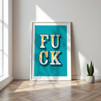 Framed artwork with bold text on a teal background in a room with a plant and window.