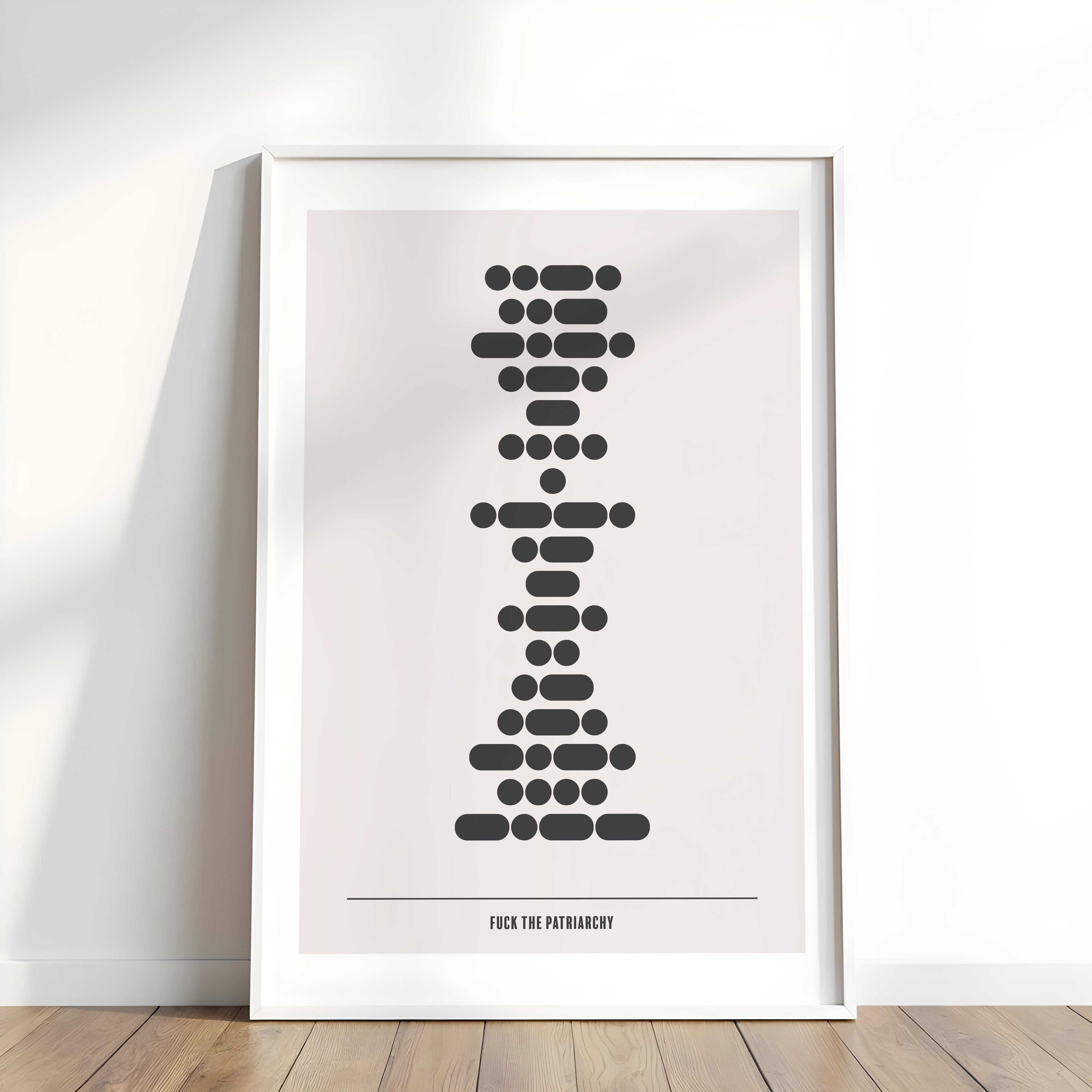 Framed artwork with a stylized design on a white wall.