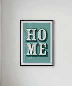 Framed artwork with 'HOME' text on a light gray wall