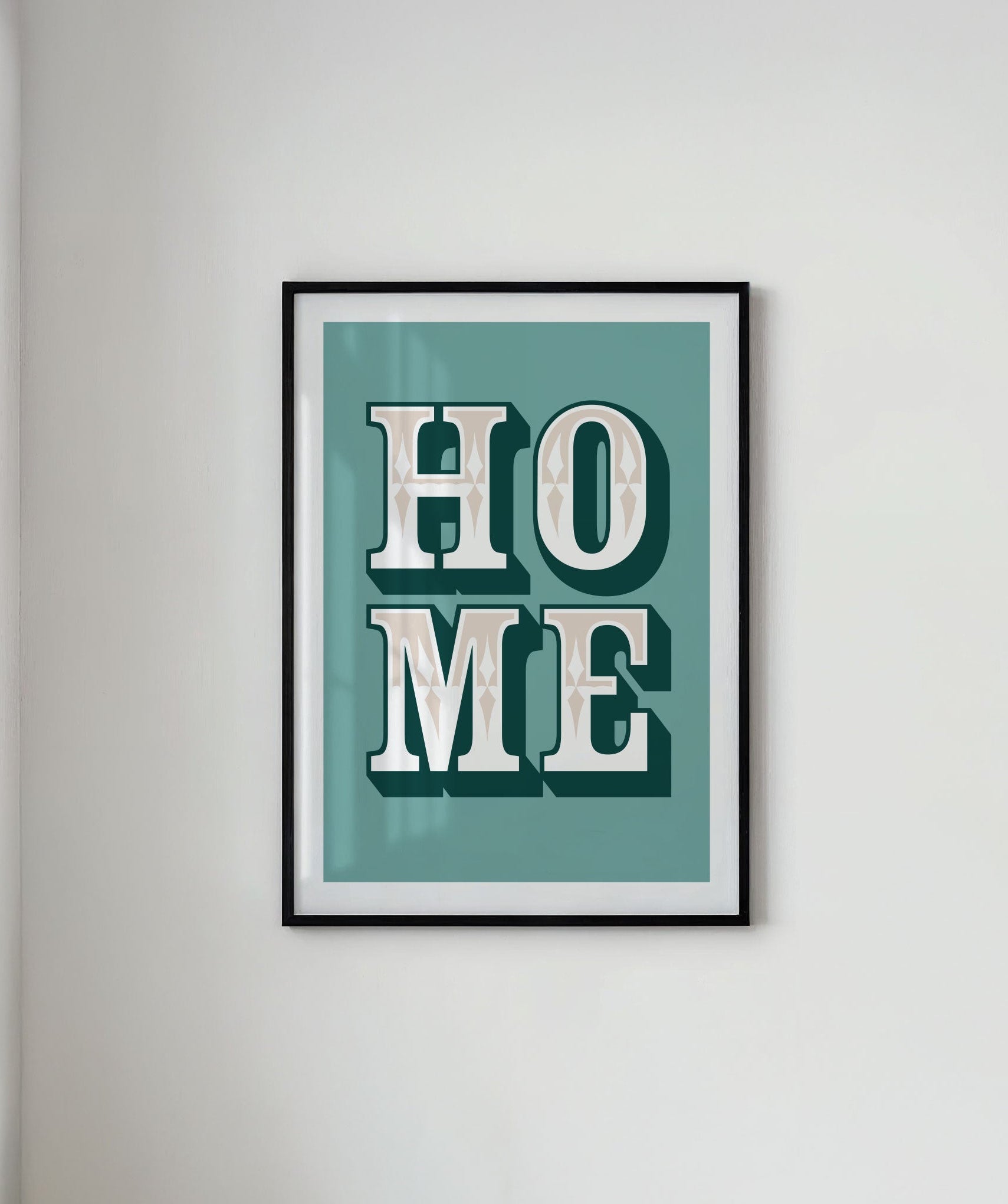 Framed artwork with 'HOME' text on a light gray wall