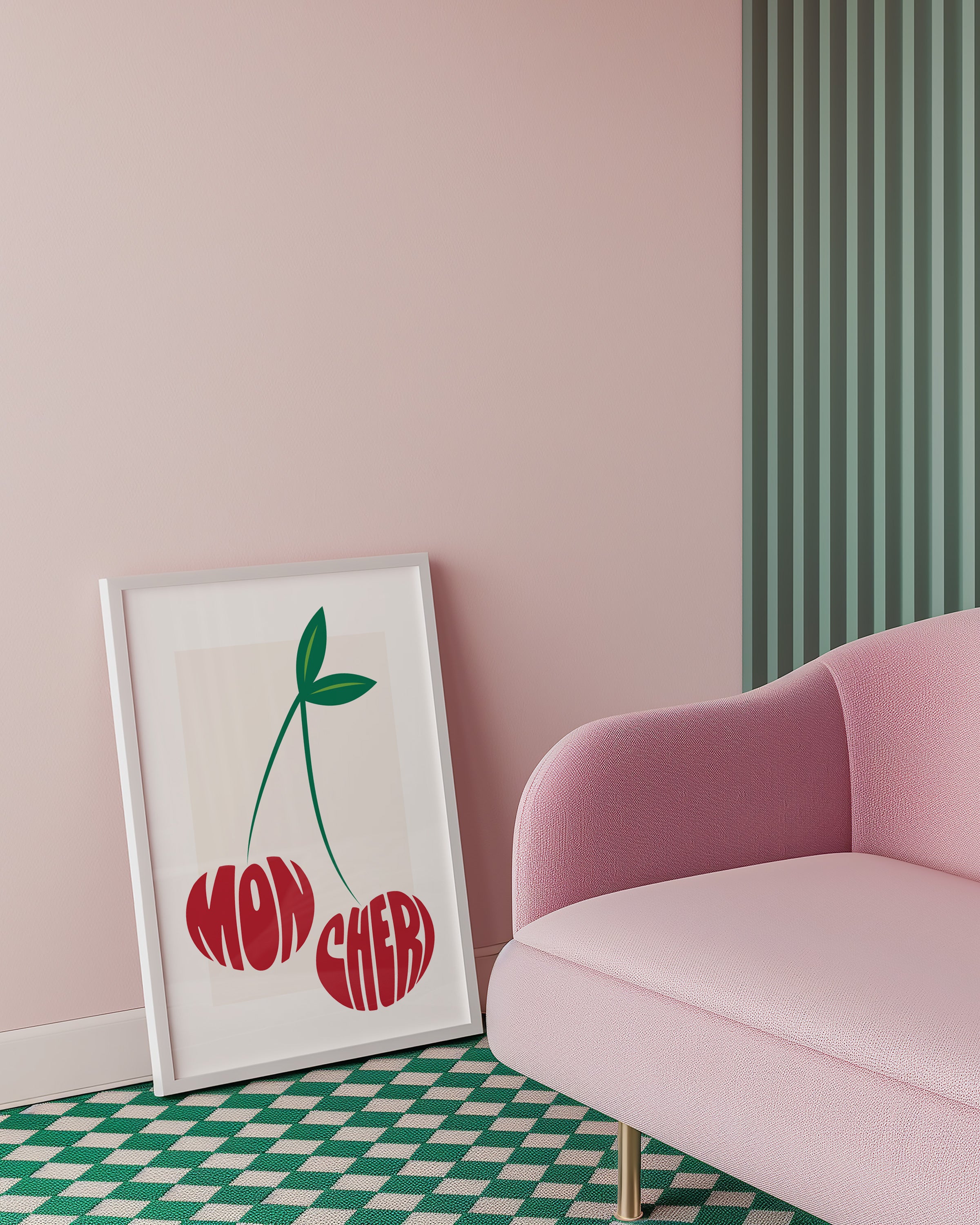 Framed artwork with cherries and 'Mon Cheri' text on a pink wall next to a pink sofa.