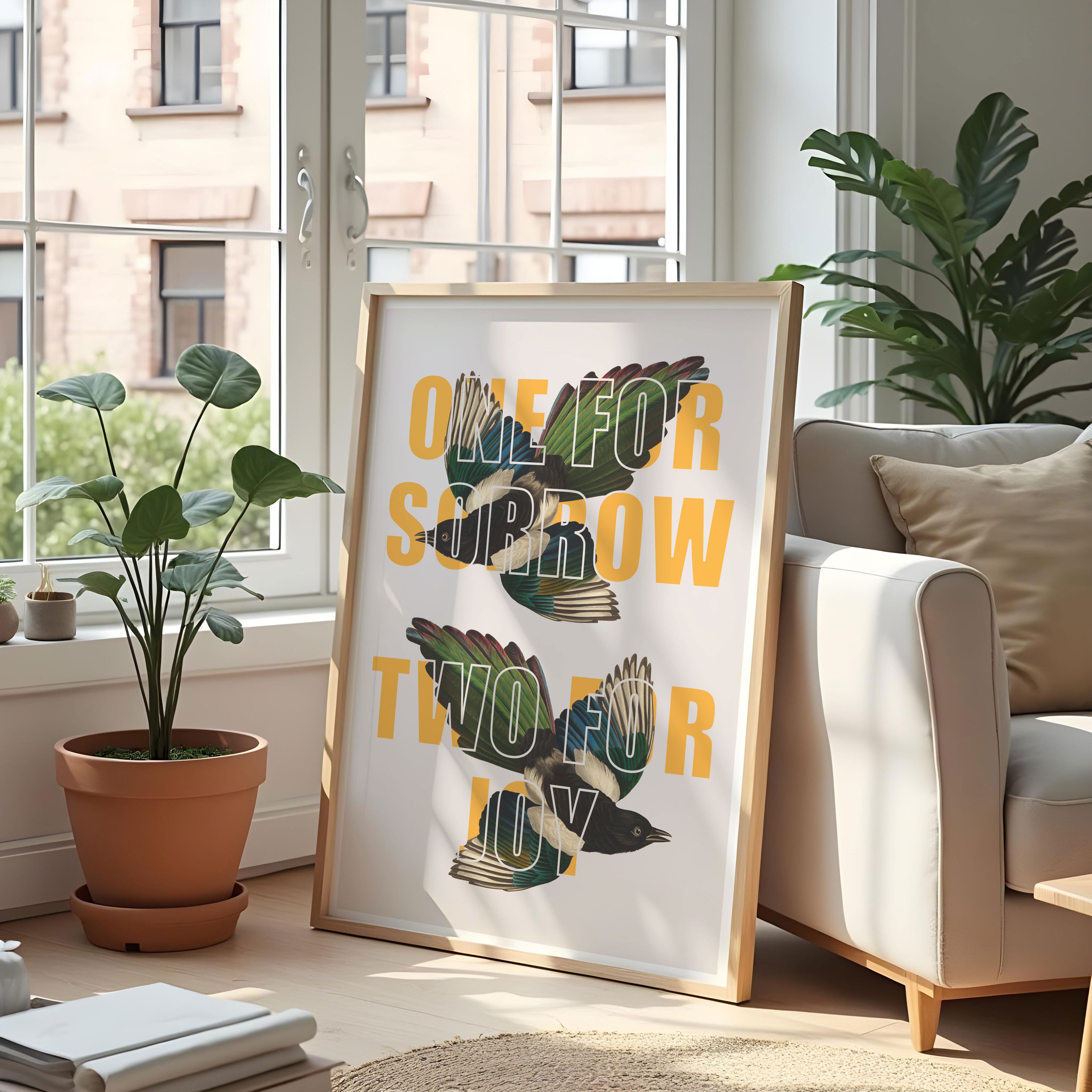 A print with the saying 'One For Sorrow, Two For Joy' overlaid on two vintage magpie drawings. 