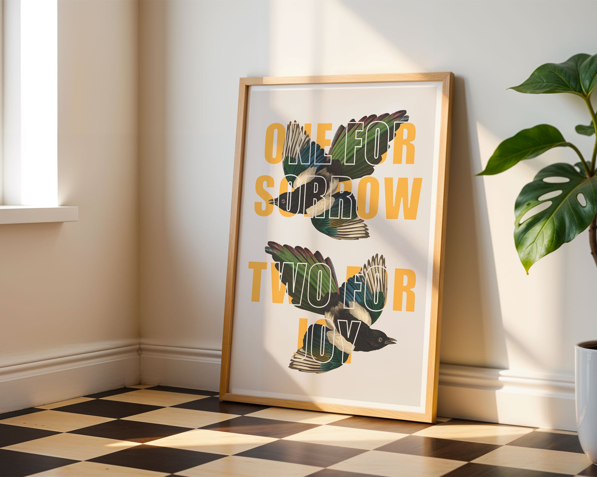 A print with the saying 'One For Sorrow, Two For Joy' overlaid on two vintage magpie drawings. 