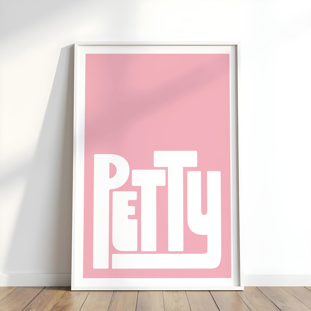 Framed poster with 'PETTY' text on a pink background.