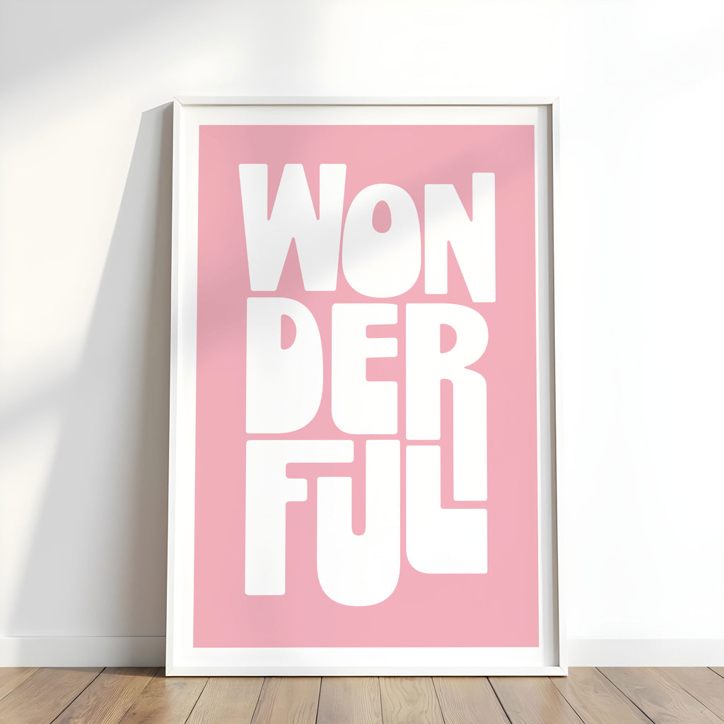 Framed artwork with 'WONDERFUL' text on a pink background.