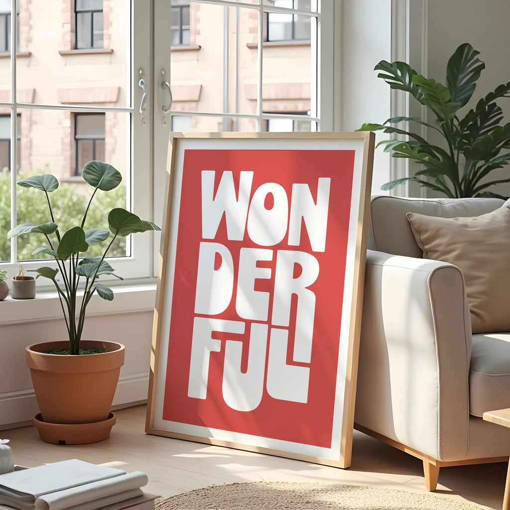 Living room with a 'Wonderful' poster on a white wall, plants, and a sofa.